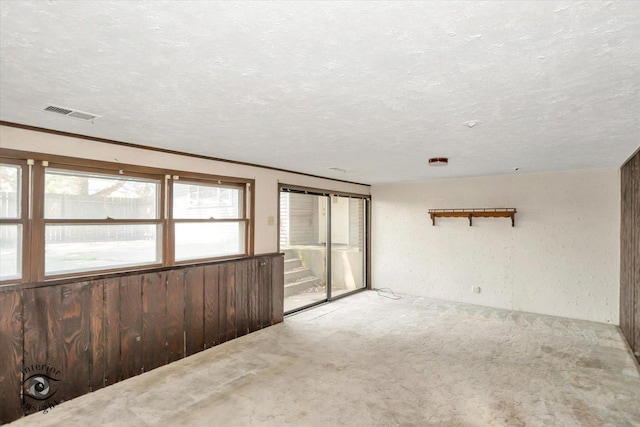 7235 174th Pl, Tinley Park, IL 60477 - carpeted spare room with a textured ceiling