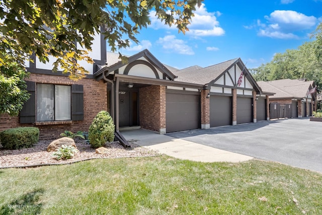 11207 Cottonwood Dr Unit 21C, Palos Hills, IL 60465 - view of front of home with brick siding and a front yard