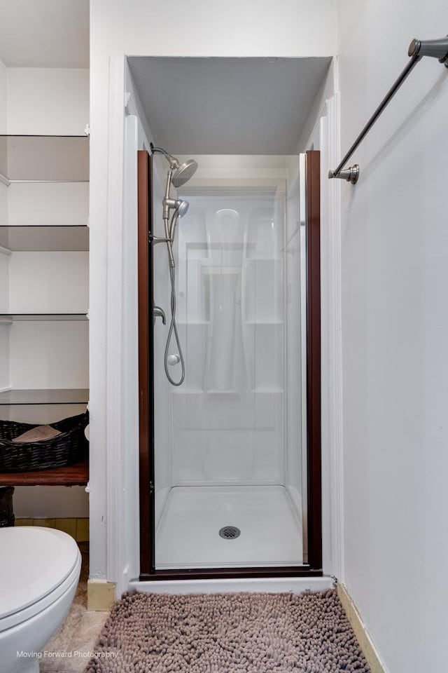 11207 Cottonwood Dr Unit 21C, Palos Hills, IL 60465 - bathroom with a shower stall and toilet