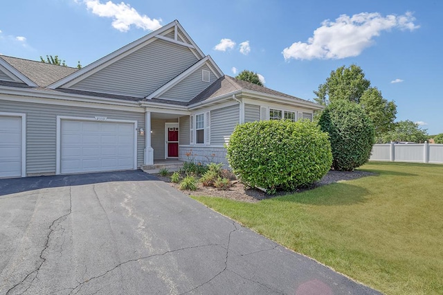 2559 Lincoln Park Ct Unit 2559, Crest Hill, IL 60403 - view of front facade featuring asphalt driveway, a garage, and a shingled roof