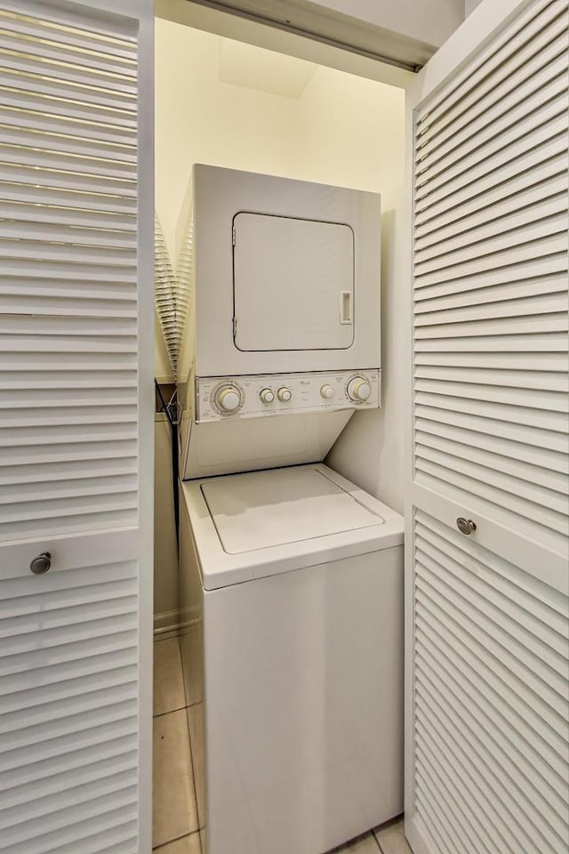 7501 Brown Ave Unit 3C, Forest Park, IL 60130 - washroom featuring stacked washing machine and dryer and light tile patterned floors