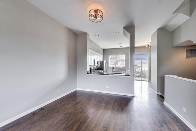 7501 Brown Ave Unit 3C, Forest Park, IL 60130 - unfurnished living room with dark wood-style floors and recessed lighting