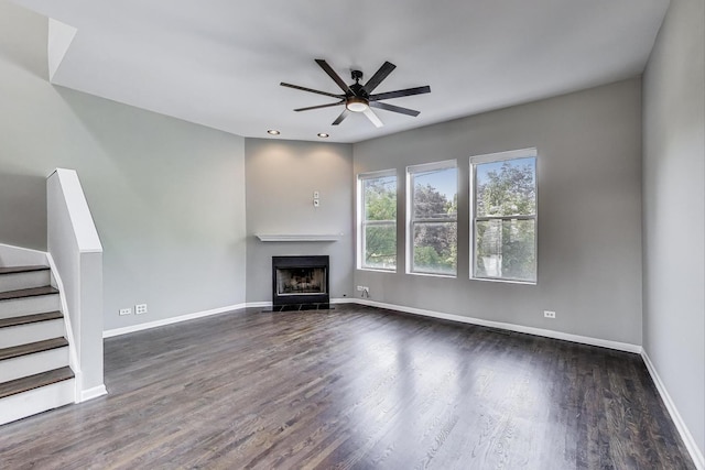 7501 Brown Ave Unit 3C, Forest Park, IL 60130 - unfurnished living room featuring dark wood-style floors, ceiling fan, a fireplace, stairs, and recessed lighting