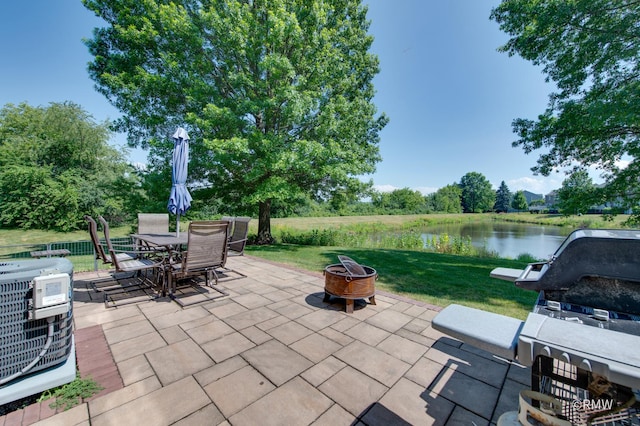 1261 River Ash Ct, Bartlett, IL 60103 - view of patio with a fire pit, a water view, and outdoor dining area