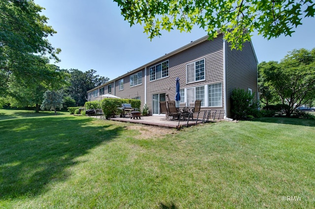 1261 River Ash Ct, Bartlett, IL 60103 - back of house with a patio area and a lawn