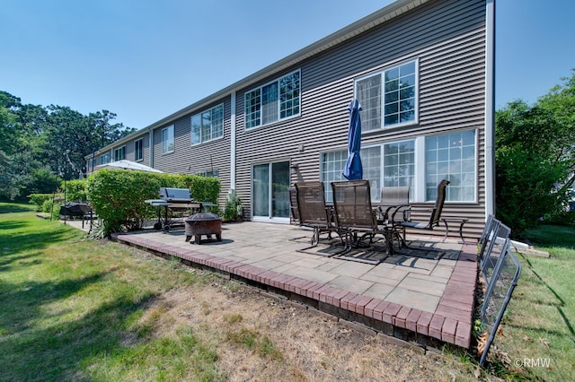 1261 River Ash Ct, Bartlett, IL 60103 - back of house with an outdoor fire pit, a patio, and a yard