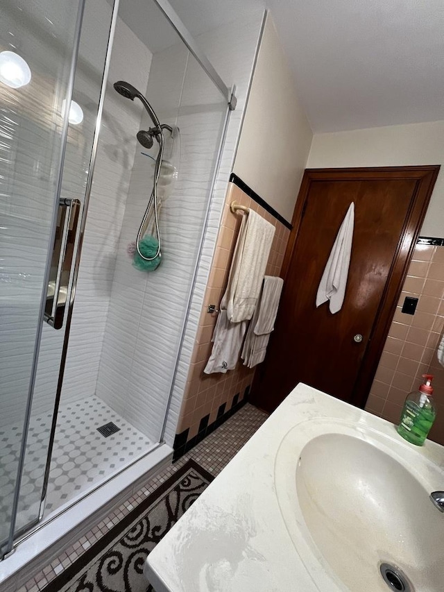 3506 N Rutherford Ave, Chicago, IL 60634 - bathroom featuring tile walls, a shower stall, and vanity