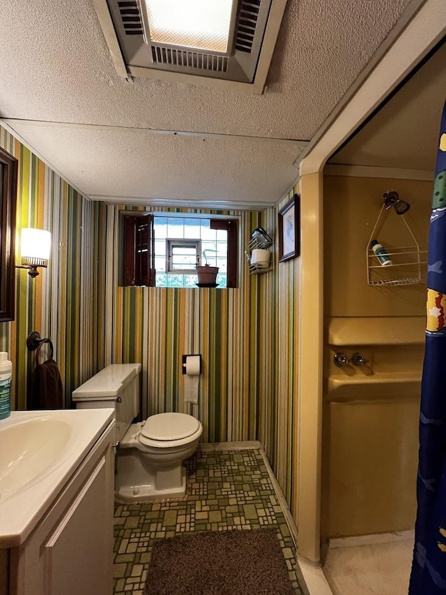 3506 N Rutherford Ave, Chicago, IL 60634 - bathroom featuring wallpapered walls, vanity, and a textured ceiling
