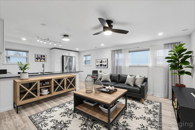 9445 W Kelvin Ln Unit 2992, Schiller Park, IL 60176 - living room with light wood-type flooring, healthy amount of natural light, a ceiling fan, and recessed lighting