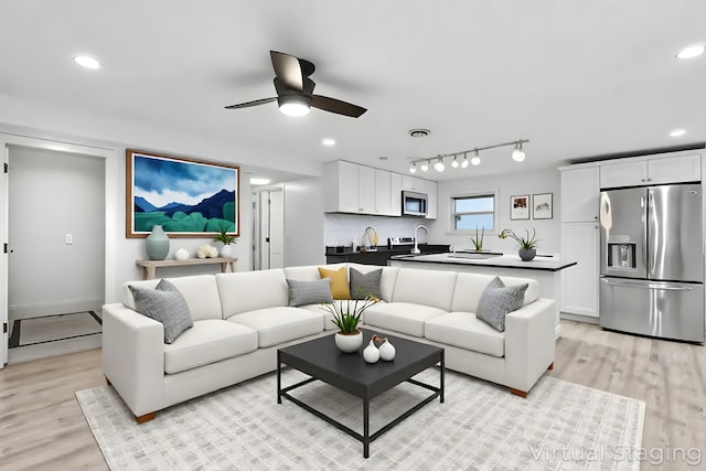 9445 W Kelvin Ln Unit 2992, Schiller Park, IL 60176 - living area with light wood-type flooring, ceiling fan, and recessed lighting