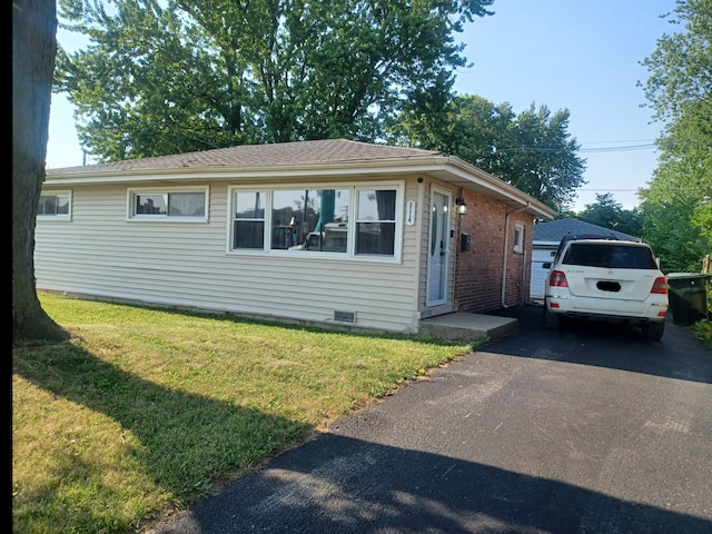 3114 W 163rd St, Markham, IL 60428 - view of front of home featuring a front lawn, brick siding, and asphalt driveway