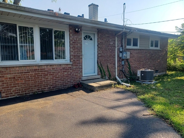 3114 W 163rd St, Markham, IL 60428 - doorway to property with brick siding and a chimney