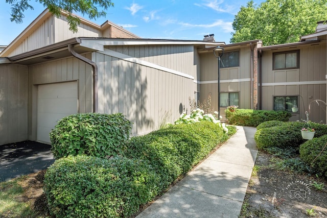 29W440 Emerald Green Dr Unit 25-F, Warrenville, IL 60555 - view of property exterior featuring a garage