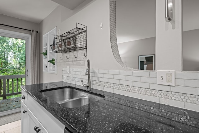 29W440 Emerald Green Dr Unit 25-F, Warrenville, IL 60555 - kitchen featuring dark stone counters, white cabinetry, and decorative backsplash