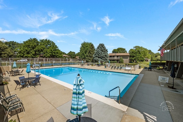 29W440 Emerald Green Dr Unit 25-F, Warrenville, IL 60555 - community pool featuring a patio