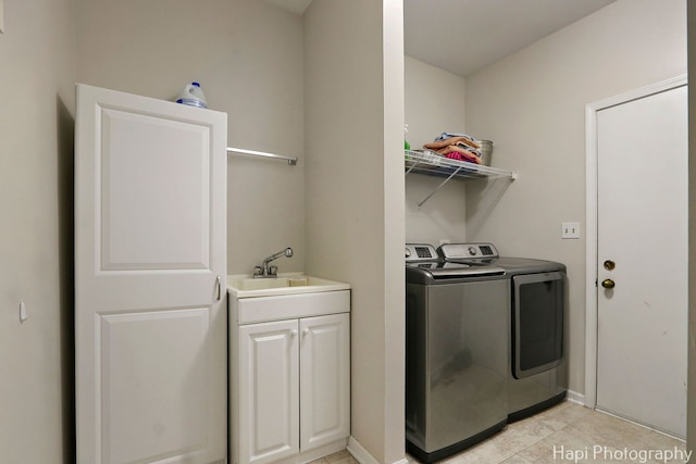 232 Bobolink Dr, Grayslake, IL 60030 - washroom with washing machine and clothes dryer, cabinet space, and light tile patterned flooring