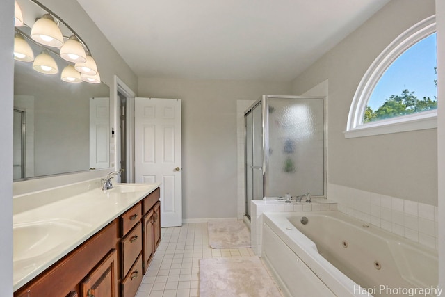 232 Bobolink Dr, Grayslake, IL 60030 - bathroom featuring a stall shower, a jetted tub, double vanity, and tile patterned flooring