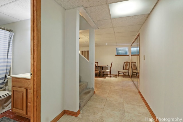 232 Bobolink Dr, Grayslake, IL 60030 - corridor with a drop ceiling, stairway, and light tile patterned flooring