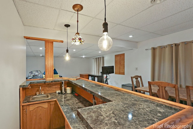 232 Bobolink Dr, Grayslake, IL 60030 - kitchen featuring a drop ceiling, dark countertops, and decorative light fixtures