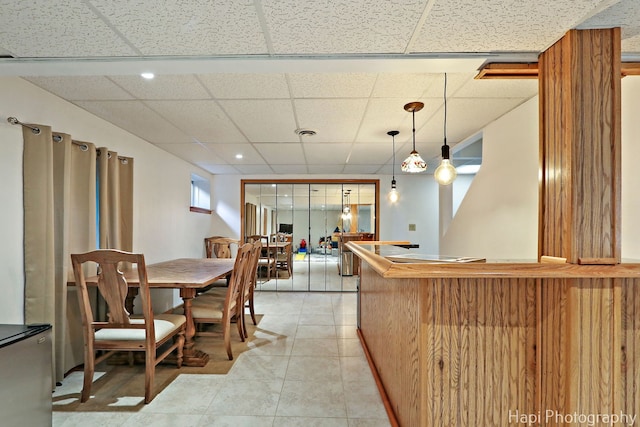 232 Bobolink Dr, Grayslake, IL 60030 - kitchen featuring a drop ceiling, light tile patterned floors, recessed lighting, and pendant lighting