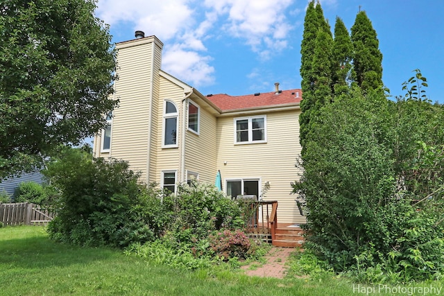 232 Bobolink Dr, Grayslake, IL 60030 - rear view of property with a chimney and a wooden deck