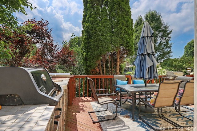 232 Bobolink Dr, Grayslake, IL 60030 - wooden terrace featuring outdoor dining area and a grill