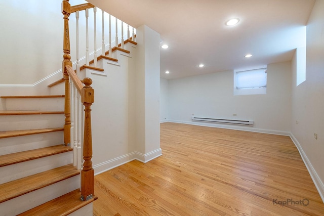 2318 S Central Park Ave Unit 101, Chicago, IL 60623 - staircase with a baseboard heating unit, wood finished floors, and recessed lighting