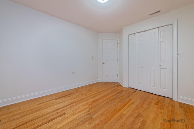 2318 S Central Park Ave Unit 101, Chicago, IL 60623 - unfurnished bedroom featuring light wood-type flooring and a closet