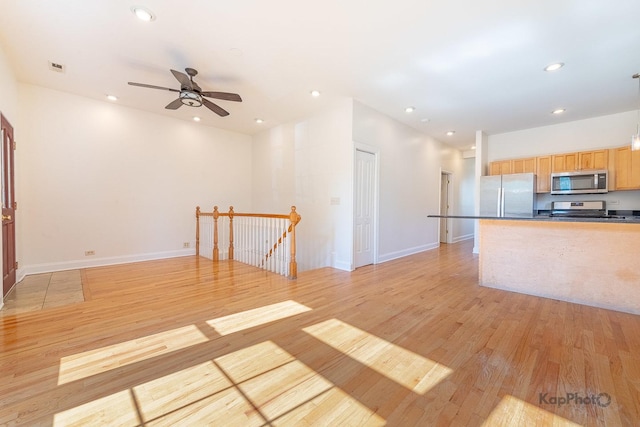 2318 S Central Park Ave Unit 101, Chicago, IL 60623 - unfurnished living room featuring light wood-style floors, a ceiling fan, and recessed lighting