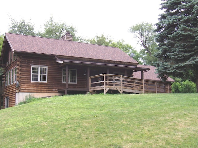 26901 W Burkhart Ln, Ingleside, IL 60041 - rear view of house featuring log exterior, a yard, a chimney, and a shingled roof