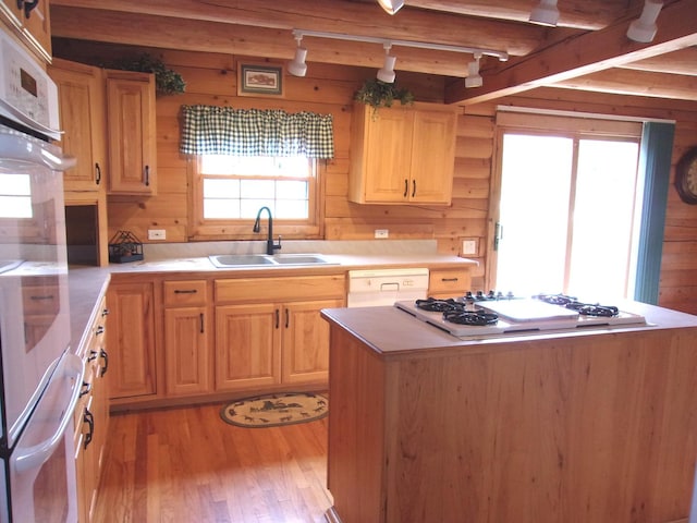 26901 W Burkhart Ln, Ingleside, IL 60041 - kitchen featuring white appliances, light wood finished floors, wooden walls, track lighting, and light brown cabinetry