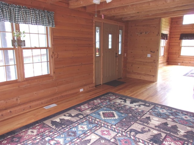 26901 W Burkhart Ln, Ingleside, IL 60041 - entrance foyer with wood walls, wood finished floors, and beam ceiling