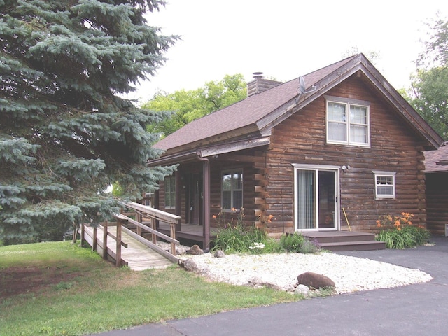 26901 W Burkhart Ln, Ingleside, IL 60041 - cabin with a chimney, log siding, and roof with shingles