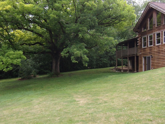26901 W Burkhart Ln, Ingleside, IL 60041 - view of green lawn with a deck and a wooded view