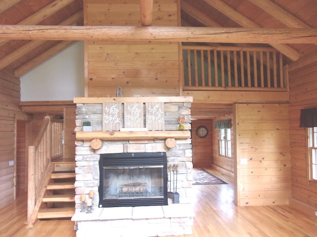 26901 W Burkhart Ln, Ingleside, IL 60041 - detailed view of wooden walls, wood finished floors, a wood ceiling with exposed beams, and a stone fireplace