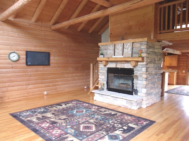 26901 W Burkhart Ln, Ingleside, IL 60041 - unfurnished living room with wood finished floors, wood walls, a wooden ceiling with exposed beams, a fireplace, and high vaulted ceiling