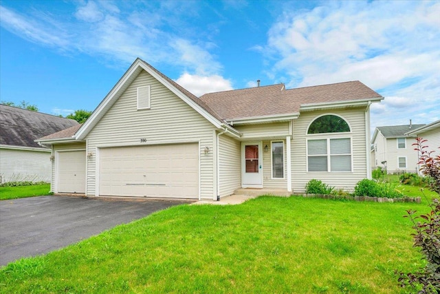 390 Madeline Trl, Rockford, IL 61107 - view of front facade with a garage, a front lawn, asphalt driveway, and roof with shingles