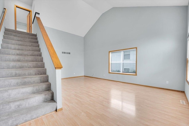 390 Madeline Trl, Rockford, IL 61107 - stairs with wood finished floors and vaulted ceiling