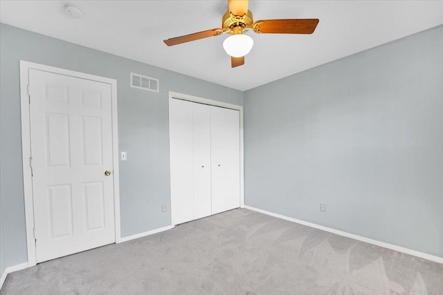 390 Madeline Trl, Rockford, IL 61107 - unfurnished bedroom featuring carpet flooring, a closet, and a ceiling fan