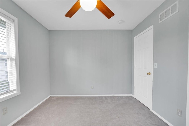 390 Madeline Trl, Rockford, IL 61107 - spare room with a ceiling fan, carpet flooring, healthy amount of natural light, and a smoke detector