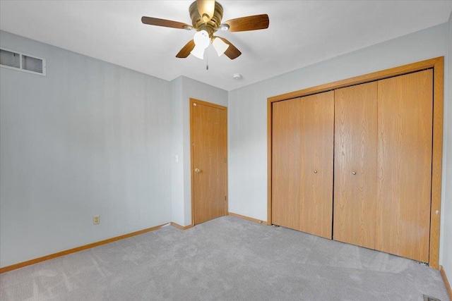 390 Madeline Trl, Rockford, IL 61107 - unfurnished bedroom with light carpet, a closet, and ceiling fan