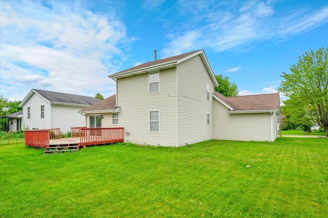 390 Madeline Trl, Rockford, IL 61107 - back of house featuring a wooden deck, a yard, and a shingled roof