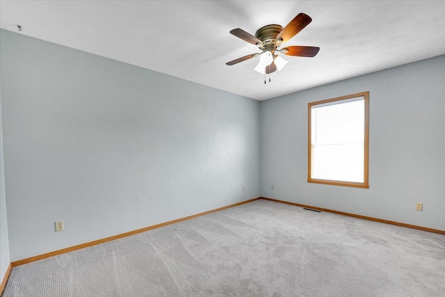 390 Madeline Trl, Rockford, IL 61107 - carpeted spare room featuring baseboards and a ceiling fan