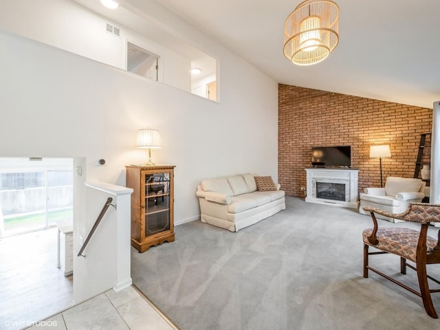 534 E Main St, Barrington, IL 60010 - living area featuring lofted ceiling, brick wall, a fireplace, carpet, and tile patterned flooring