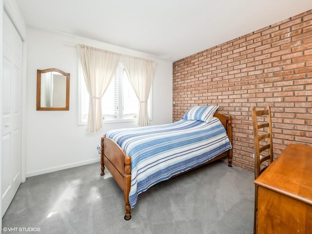 534 E Main St, Barrington, IL 60010 - carpeted bedroom featuring brick wall and baseboards
