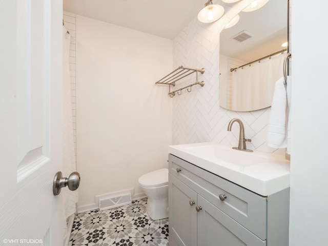 534 E Main St, Barrington, IL 60010 - bathroom with vanity, backsplash, and tile patterned flooring