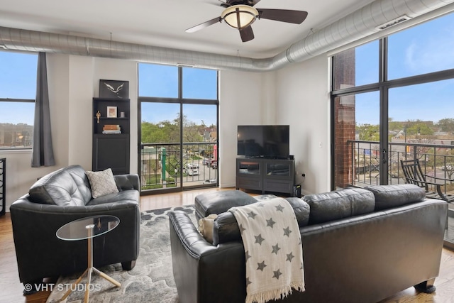 4011 N Francisco Ave Unit 310, Chicago, IL 60618 - living area featuring ceiling fan and wood finished floors