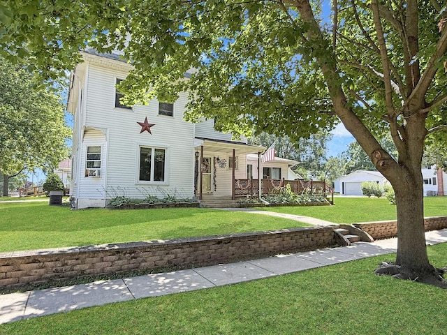 401 S Chestnut St, Shannon, IL 61078 - view of front facade with a front yard, a porch, and a detached garage