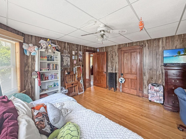 401 S Chestnut St, Shannon, IL 61078 - bedroom with wood walls, wood finished floors, and a ceiling fan