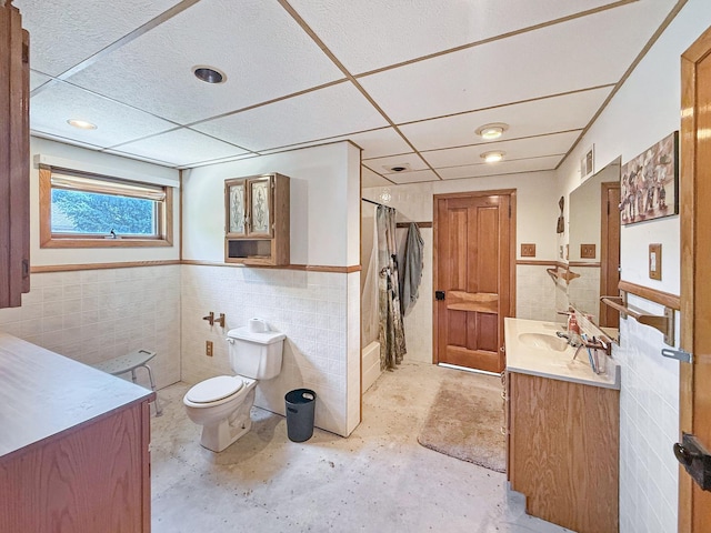 401 S Chestnut St, Shannon, IL 61078 - full bathroom featuring tile walls, vanity, a shower with shower curtain, wainscoting, and concrete floors